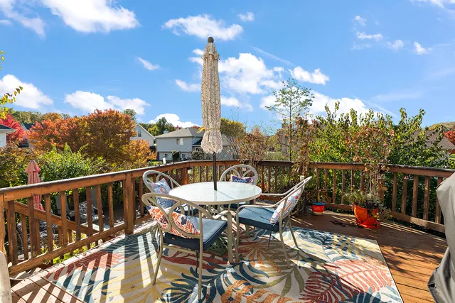 a view of a chairs and tables in the balcony