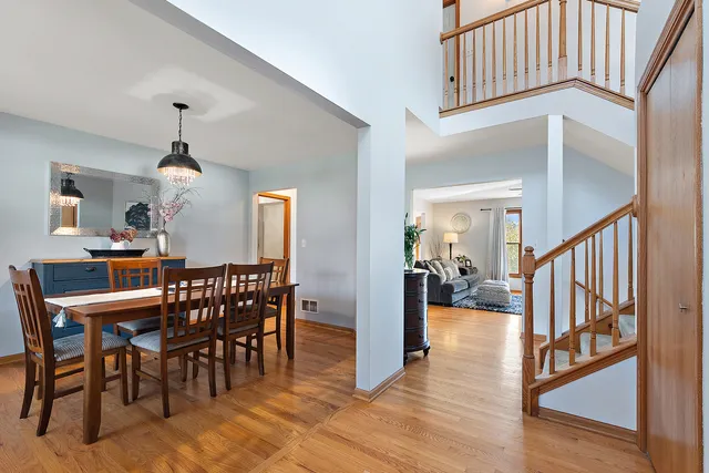 a view of a dining room and hall with furniture