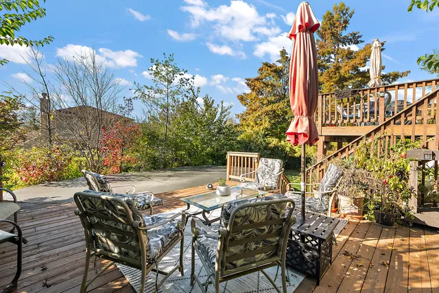 a view of a chairs and table on the wooden floor