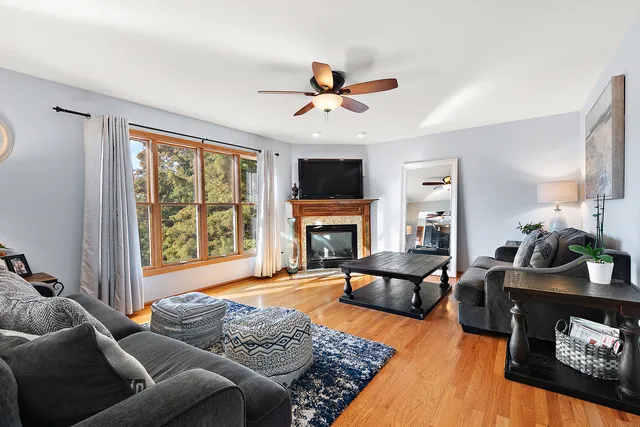 a living room with furniture fireplace and a flat screen tv