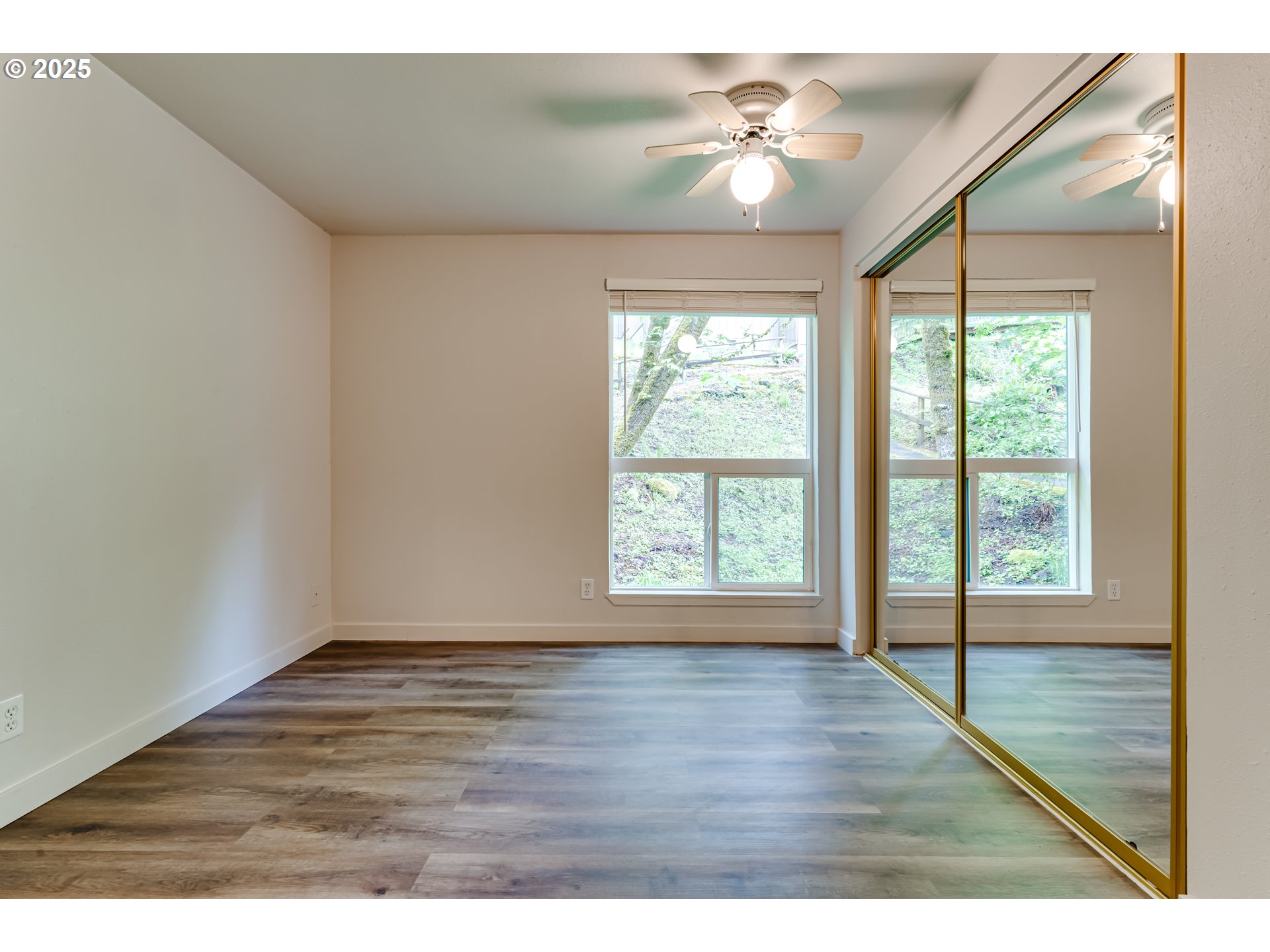 418 Stonewood Drive Eugene, OR 97405 - Photo 14 of 36 a view of an empty room with a window