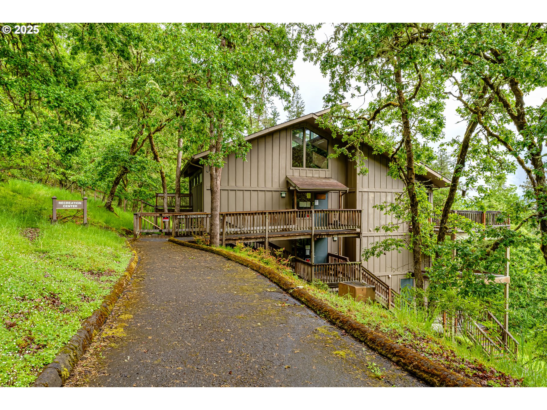 418 Stonewood Drive Eugene, OR 97405 - Photo 28 of 36 a view of a house with a yard