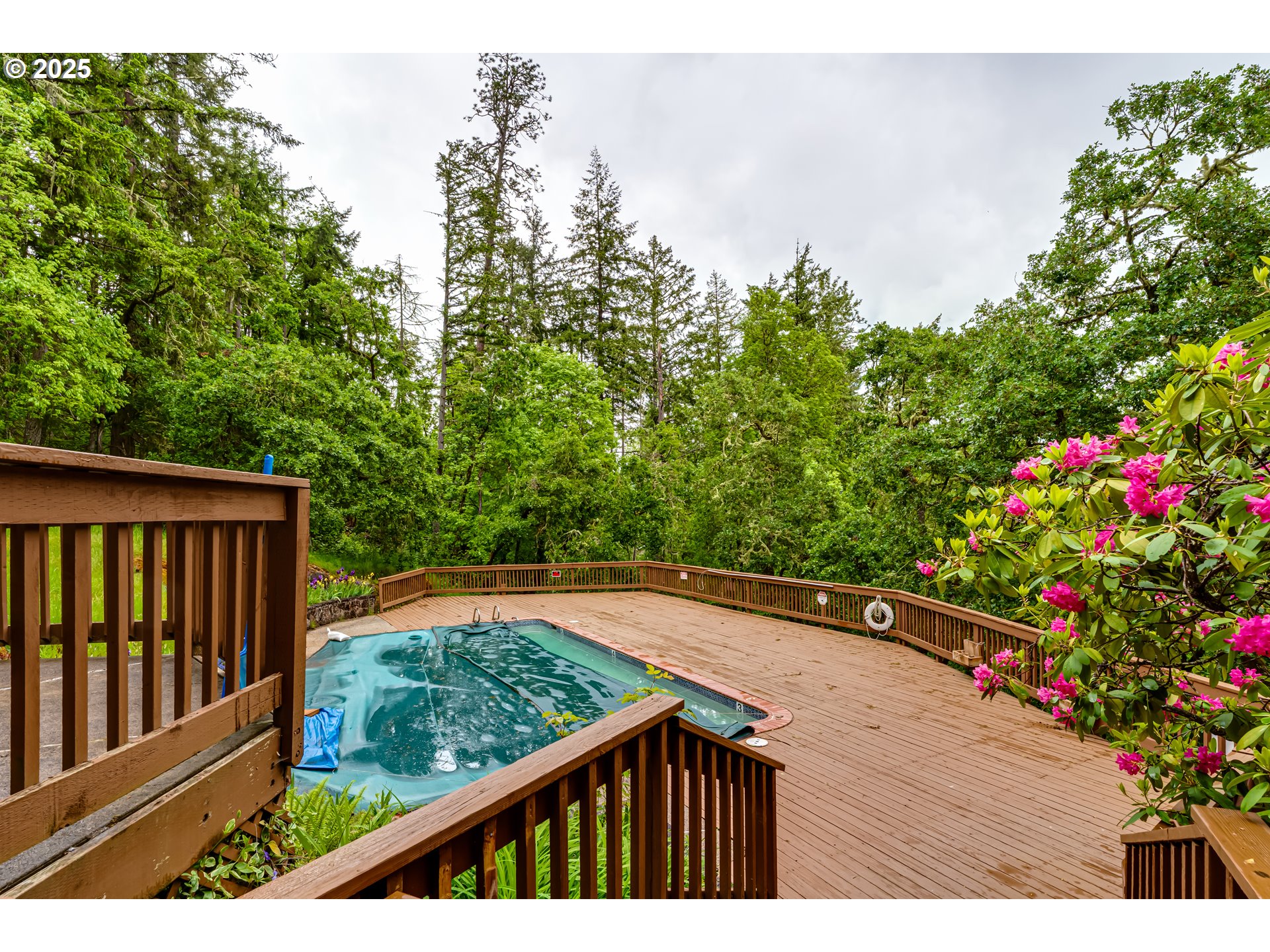 418 Stonewood Drive Eugene, OR 97405 - Photo 34 of 36 a view of a balcony with wooden floor and fence