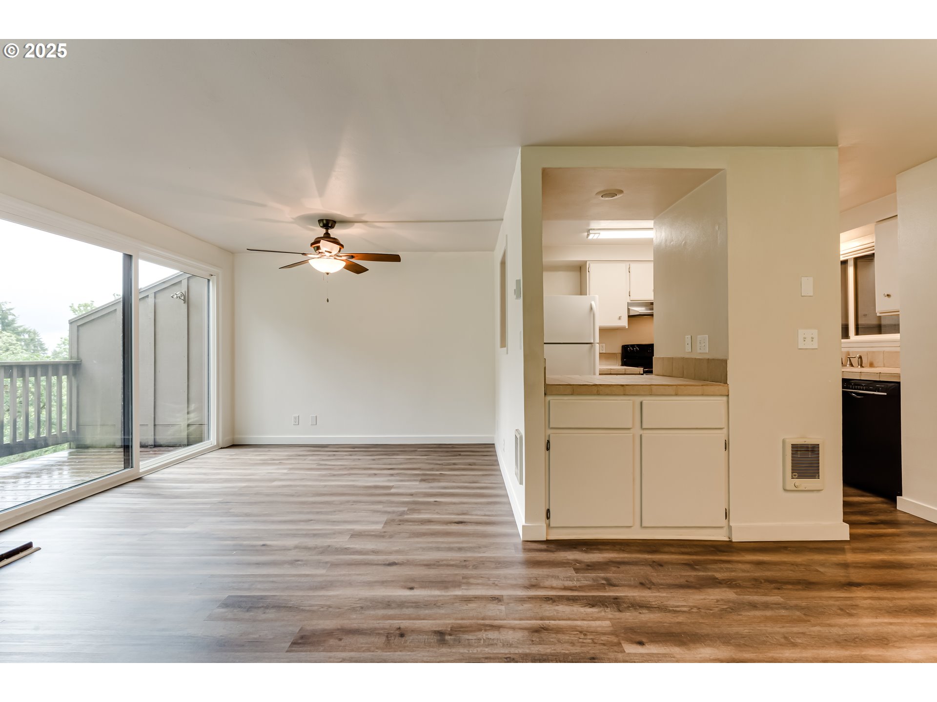 418 Stonewood Drive Eugene, OR 97405 - Photo 8 of 36 a view of a livingroom with wooden floor