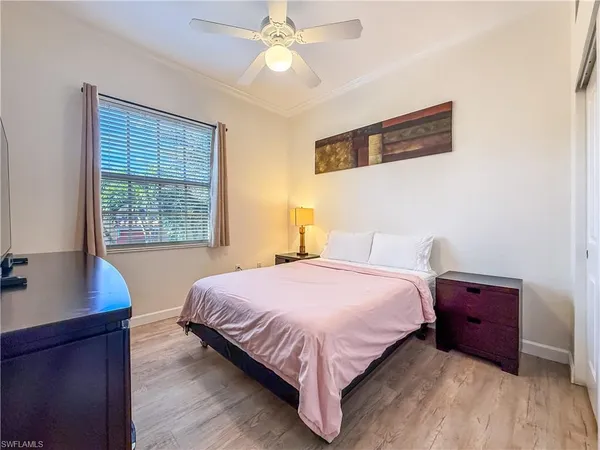 a bedroom with a bed and a desk