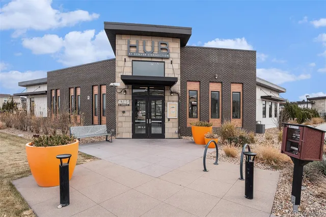 a front view of a house with outdoor seating