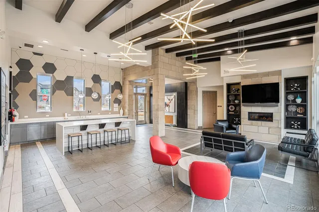 a living room with furniture fireplace and flat screen tv