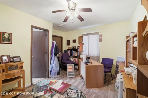 a living room with furniture workspace and a window