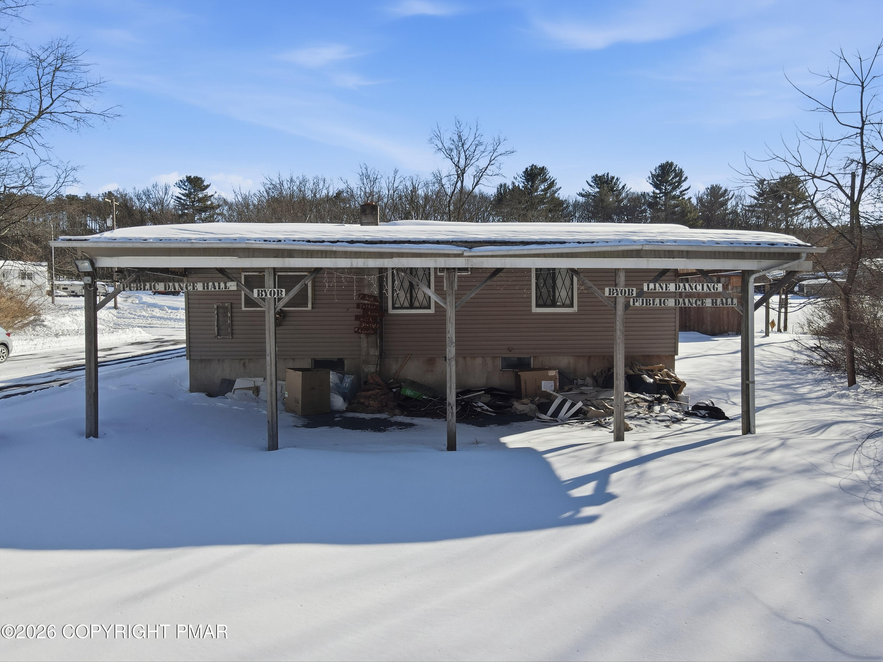 361 Interchange Road Kresgeville, PA 18333 - Photo 47 of 48 a view of a patio with table and chairs a flat tv screen