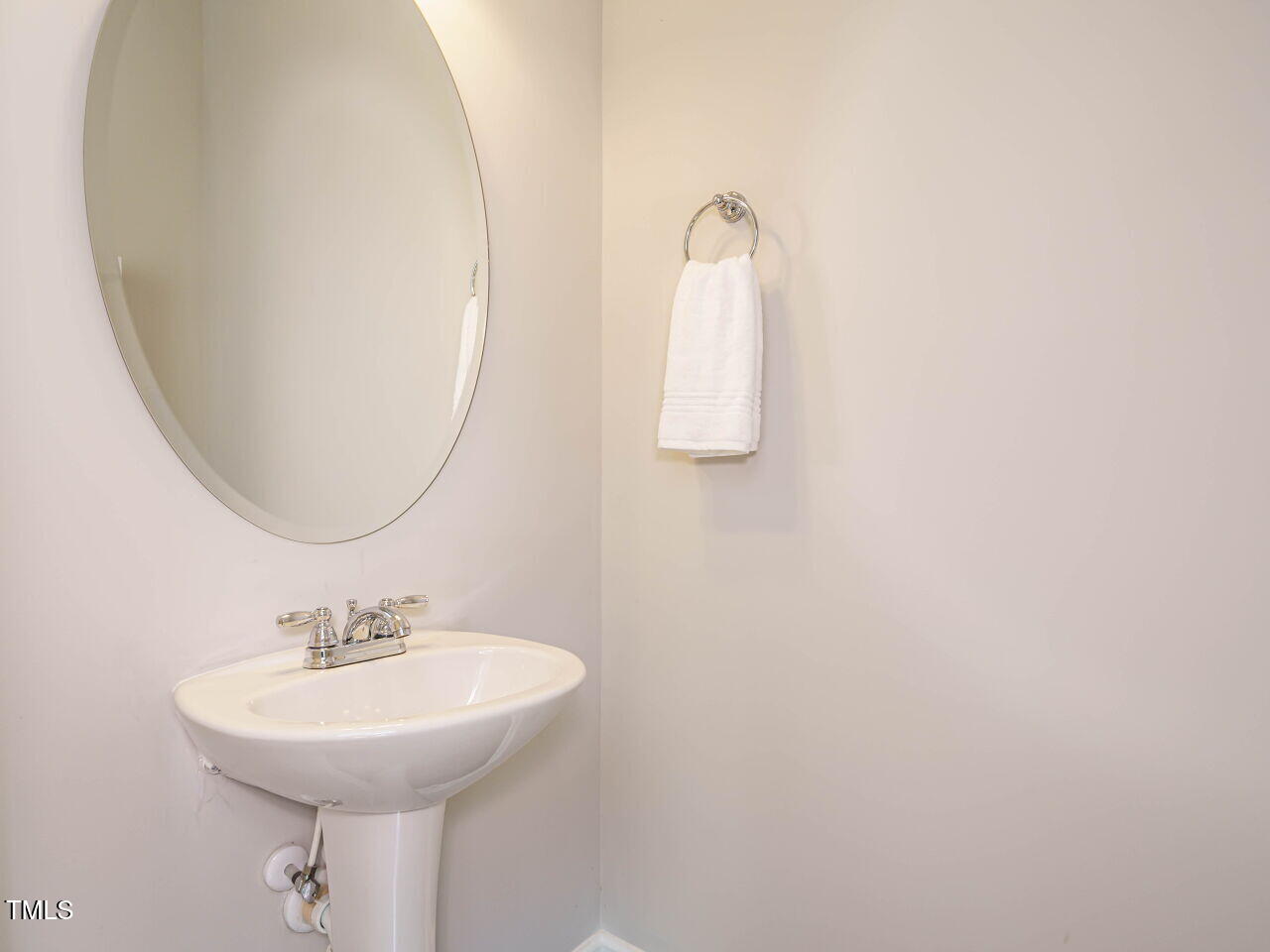 6333 Grace Lily Drive Raleigh, NC 27607 - Photo 12 of 26 a bathroom with a sink and a mirror