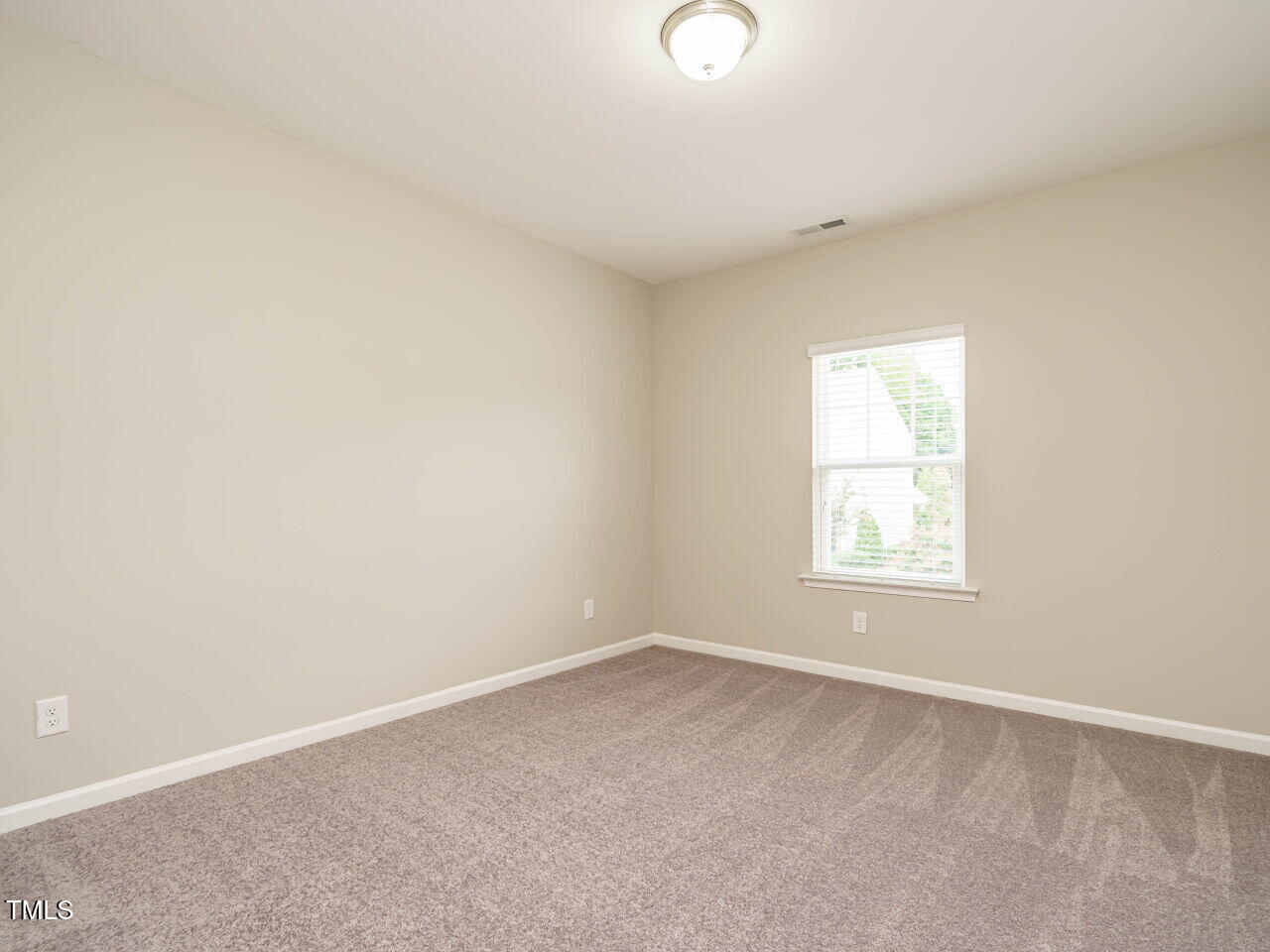 6333 Grace Lily Drive Raleigh, NC 27607 - Photo 20 of 26 an empty room with a window