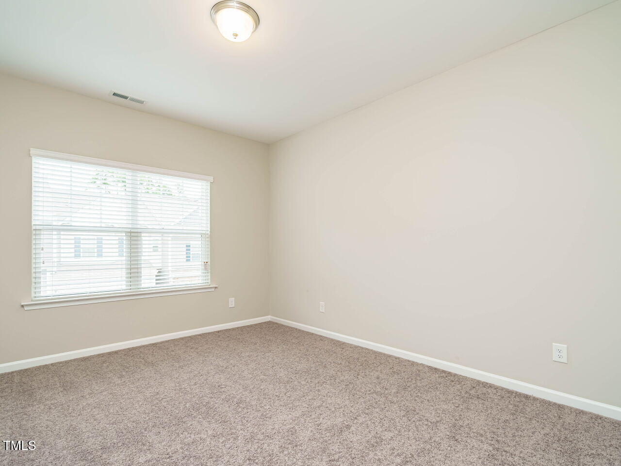 6333 Grace Lily Drive Raleigh, NC 27607 - Photo 22 of 26 an empty room with a window