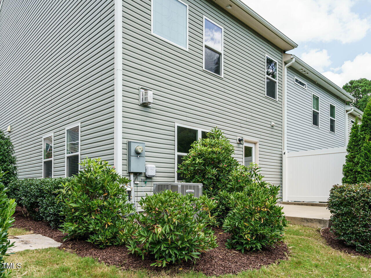 6333 Grace Lily Drive Raleigh, NC 27607 - Photo 25 of 26 a view of a house with a yard and plants