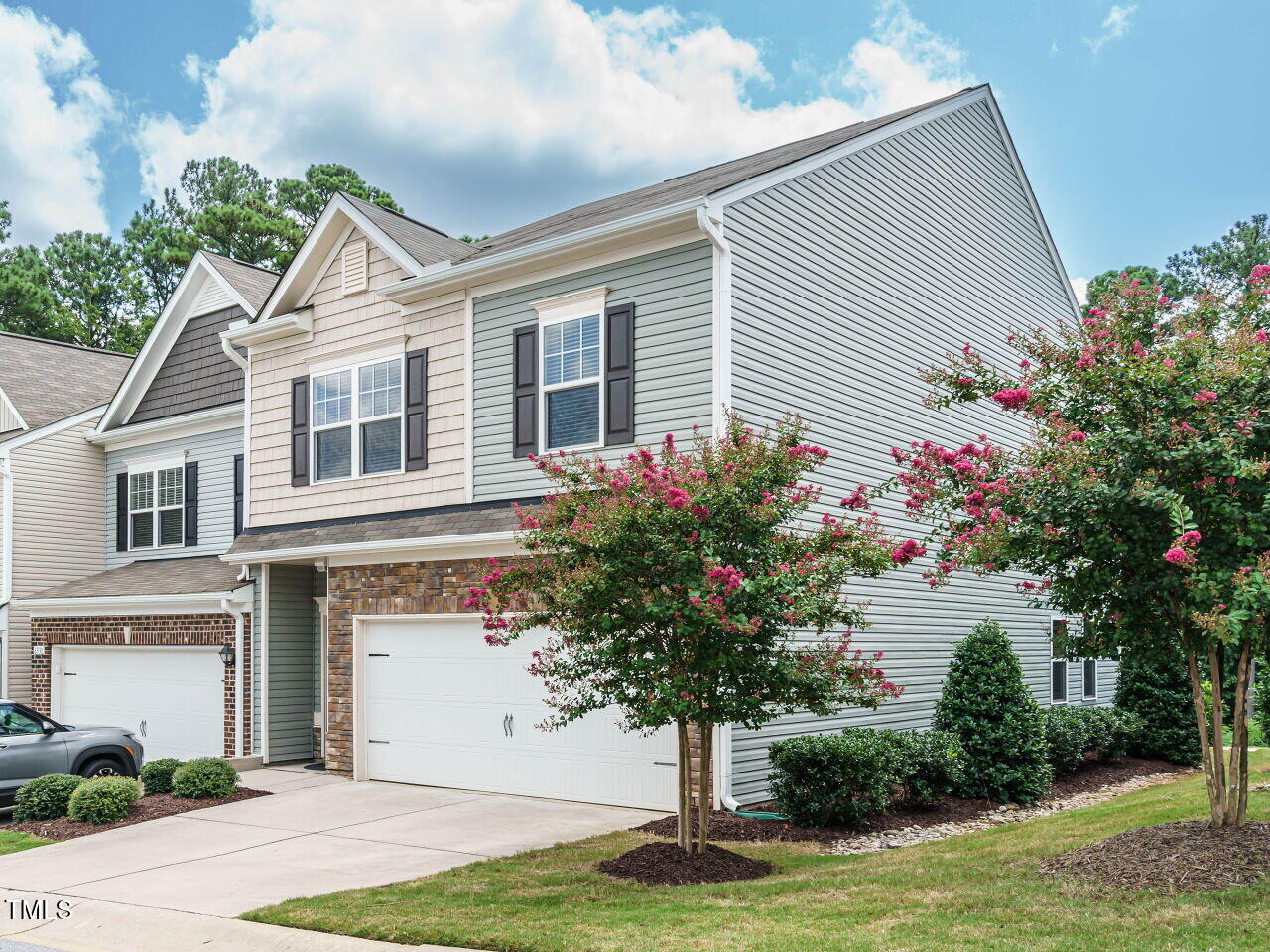 6333 Grace Lily Drive Raleigh, NC 27607 - Photo 3 of 26 a front view of a house with a yard and garage