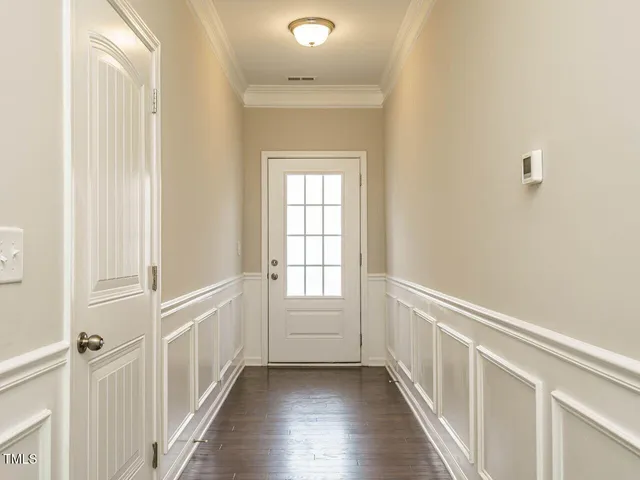 a view of an entryway with wooden floor