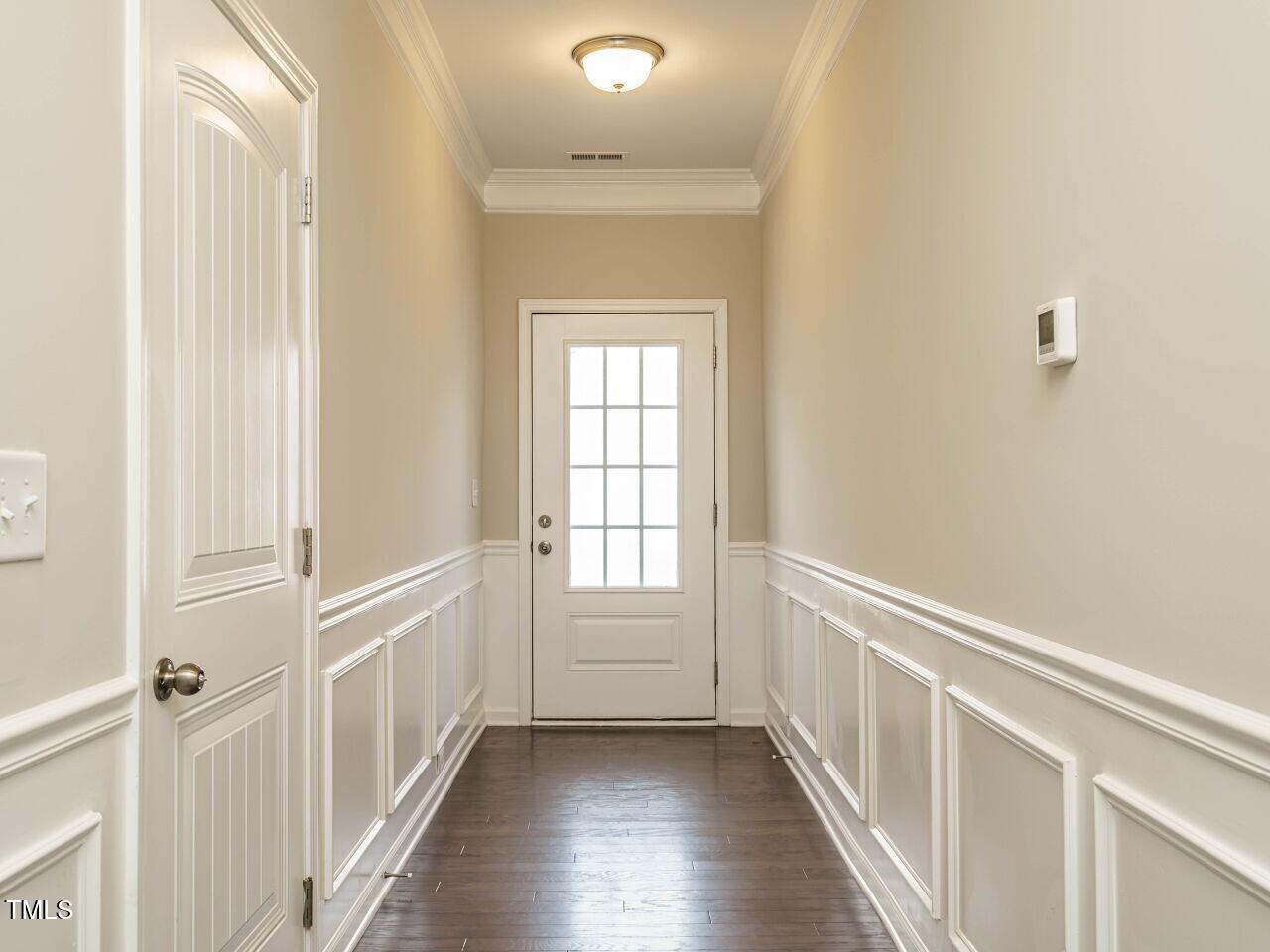 6333 Grace Lily Drive Raleigh, NC 27607 - Photo 4 of 26 a view of an entryway with wooden floor