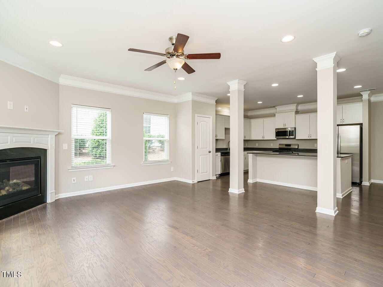 6333 Grace Lily Drive Raleigh, NC 27607 - Photo 6 of 26 a view of a kitchen and an empty room with a kitchen