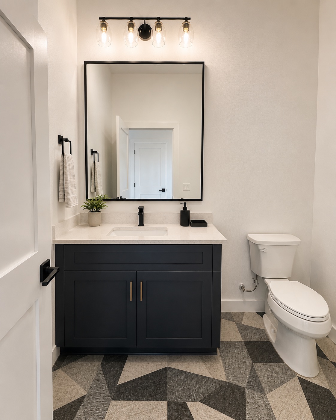 2000 Riverside Farms Road, Unit 6102 Austin, TX 78741 - Photo 8 of 11 Bold geometric tile flooring and a sleek black vanity create a striking powder room.