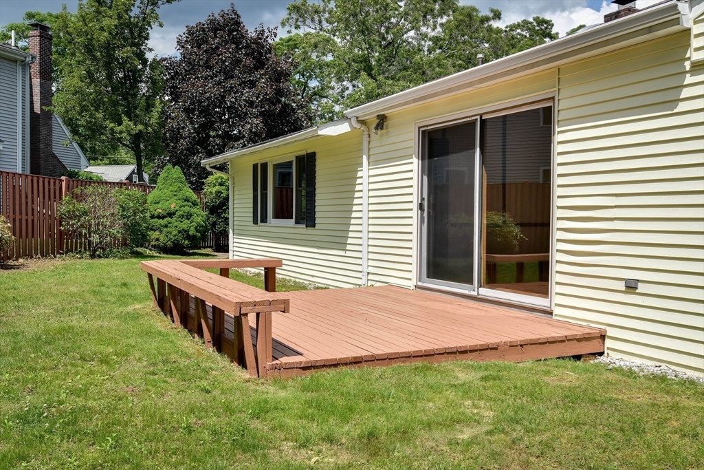 16 Arlington Road Natick, MA 01760 - Photo 20 of 34 a backyard of a house with table and chairs
