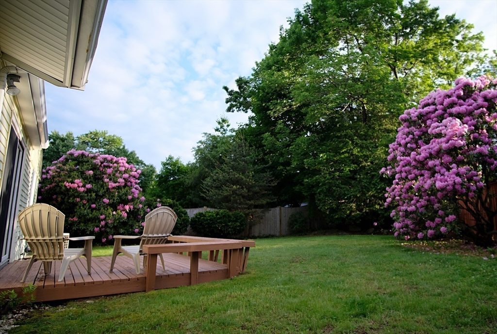 16 Arlington Road Natick, MA 01760 - Photo 22 of 34 a view of backyard with seating area and green space