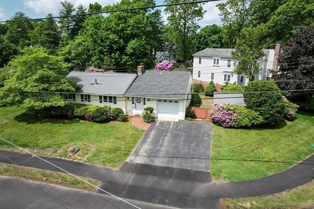 16 Arlington Road Natick, MA 01760 - Photo 33 of 34 a aerial view of a house with a yard and potted plants