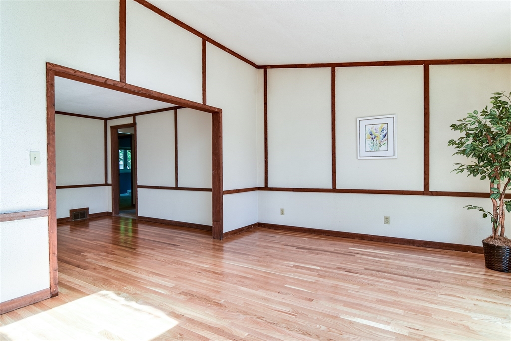 16 Arlington Road Natick, MA 01760 - Photo 6 of 34 a view of an empty room with wooden floor