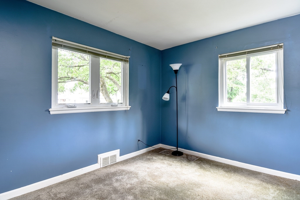 16 Arlington Road Natick, MA 01760 - Photo 10 of 34 a view of an empty room with a window