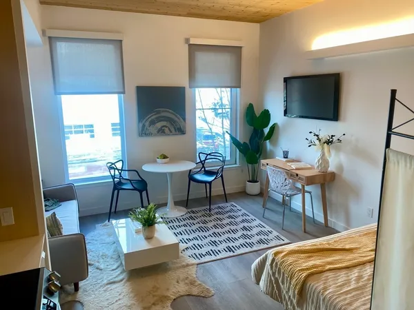 a living room with furniture and a flat screen tv