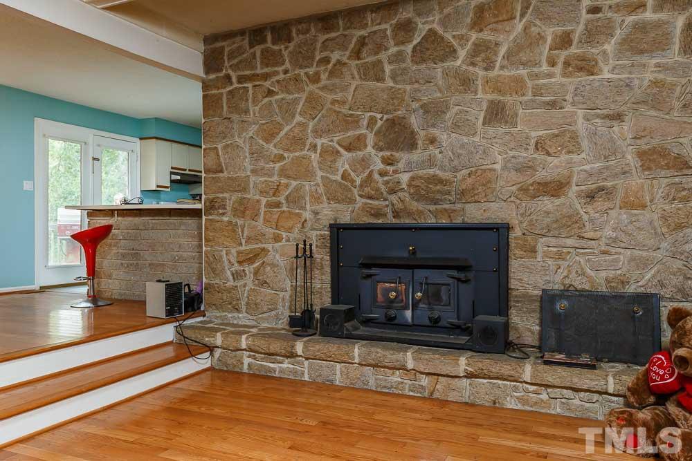 12704 Old Creedmoor Road Raleigh, NC 27613 - Photo 14 of 16 a living room with a fireplace