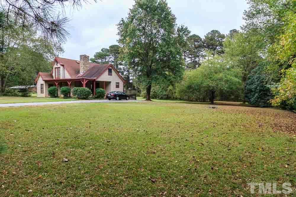 12704 Old Creedmoor Road Raleigh, NC 27613 - Photo 3 of 16 a view of a green field with house in the background
