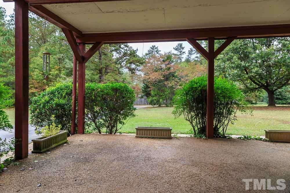 12704 Old Creedmoor Road Raleigh, NC 27613 - Photo 5 of 16 a view of backyard with large trees