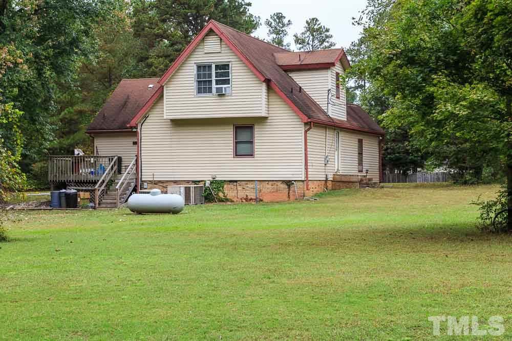 12704 Old Creedmoor Road Raleigh, NC 27613 - Photo 6 of 16 a front view of a house with garden