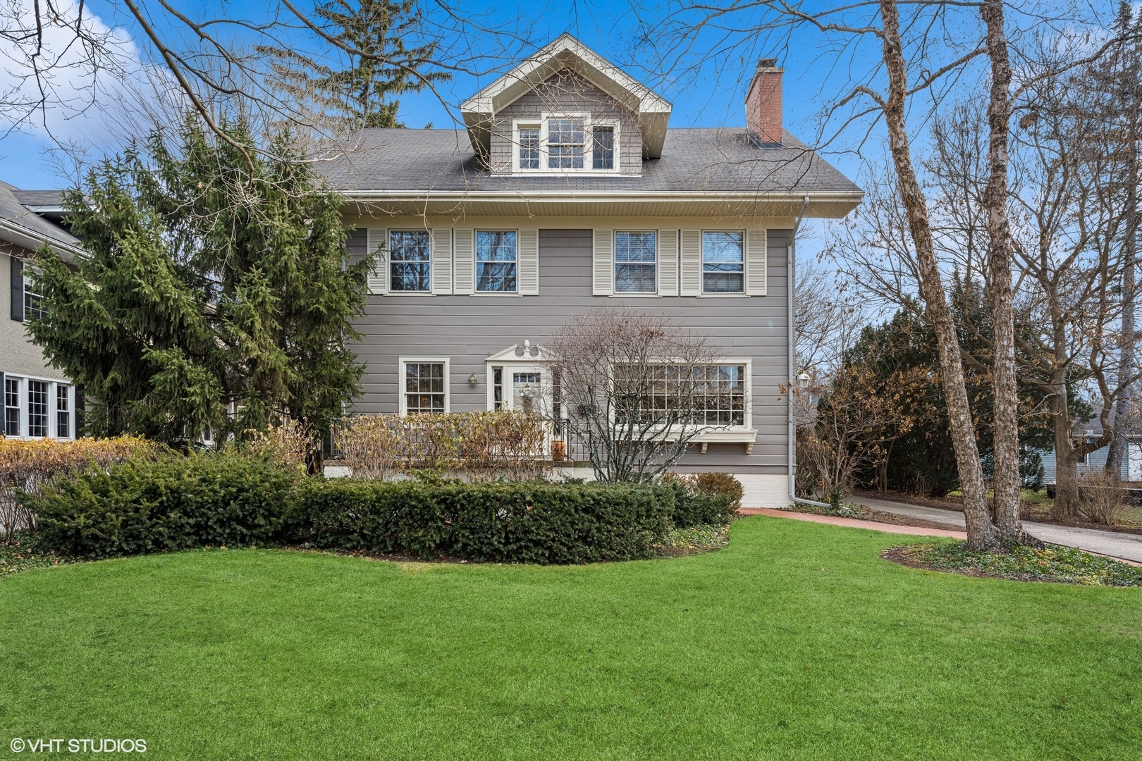 379 Ridge Avenue Winnetka, IL 60093 - Photo 1 of 31 a front view of a house with a garden