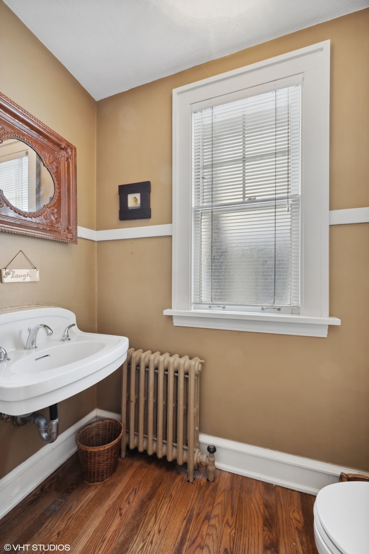 379 Ridge Avenue Winnetka, IL 60093 - Photo 12 of 31 a bathroom with a sink and a mirror