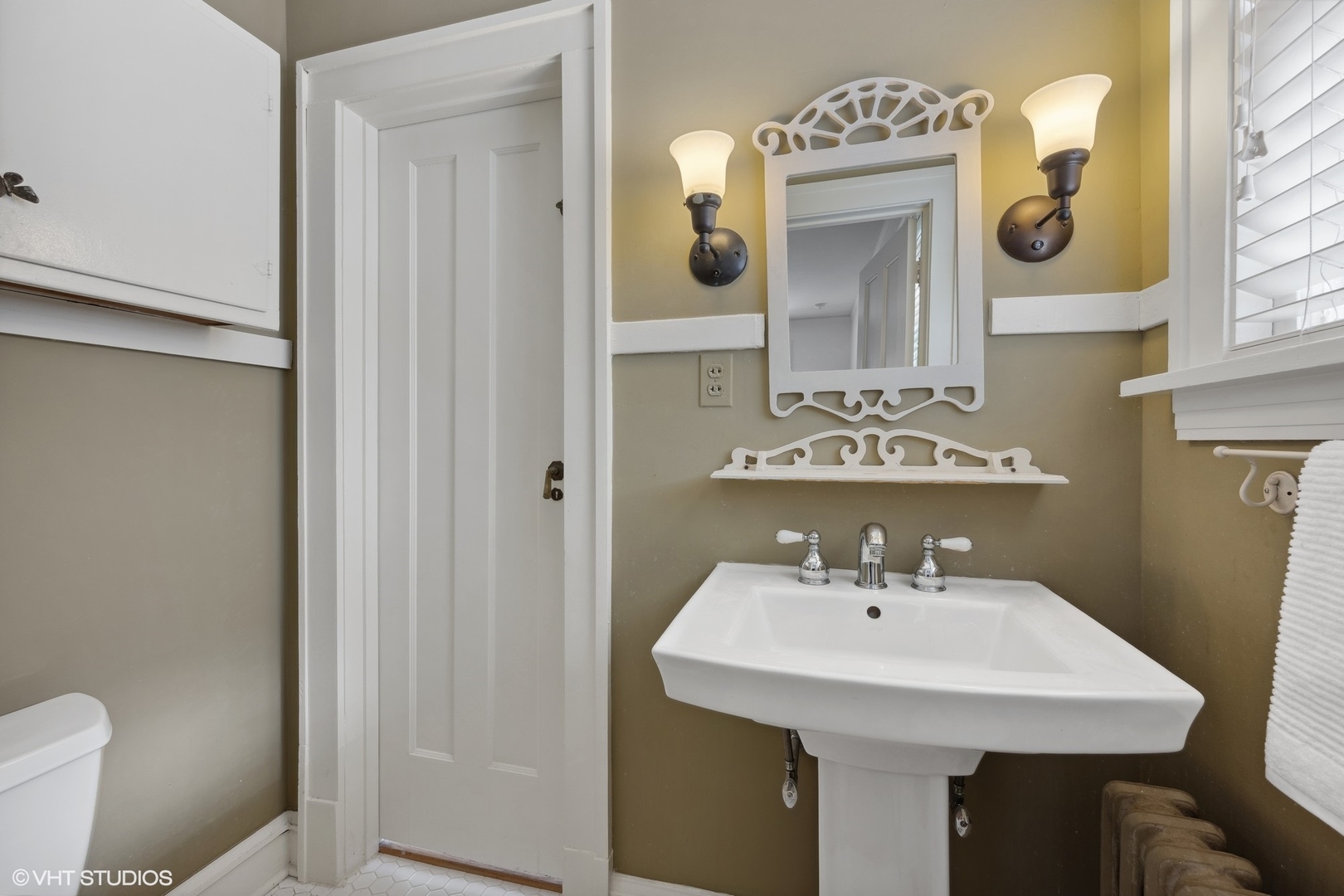 379 Ridge Avenue Winnetka, IL 60093 - Photo 14 of 31 a bathroom with a sink a toilet and mirror