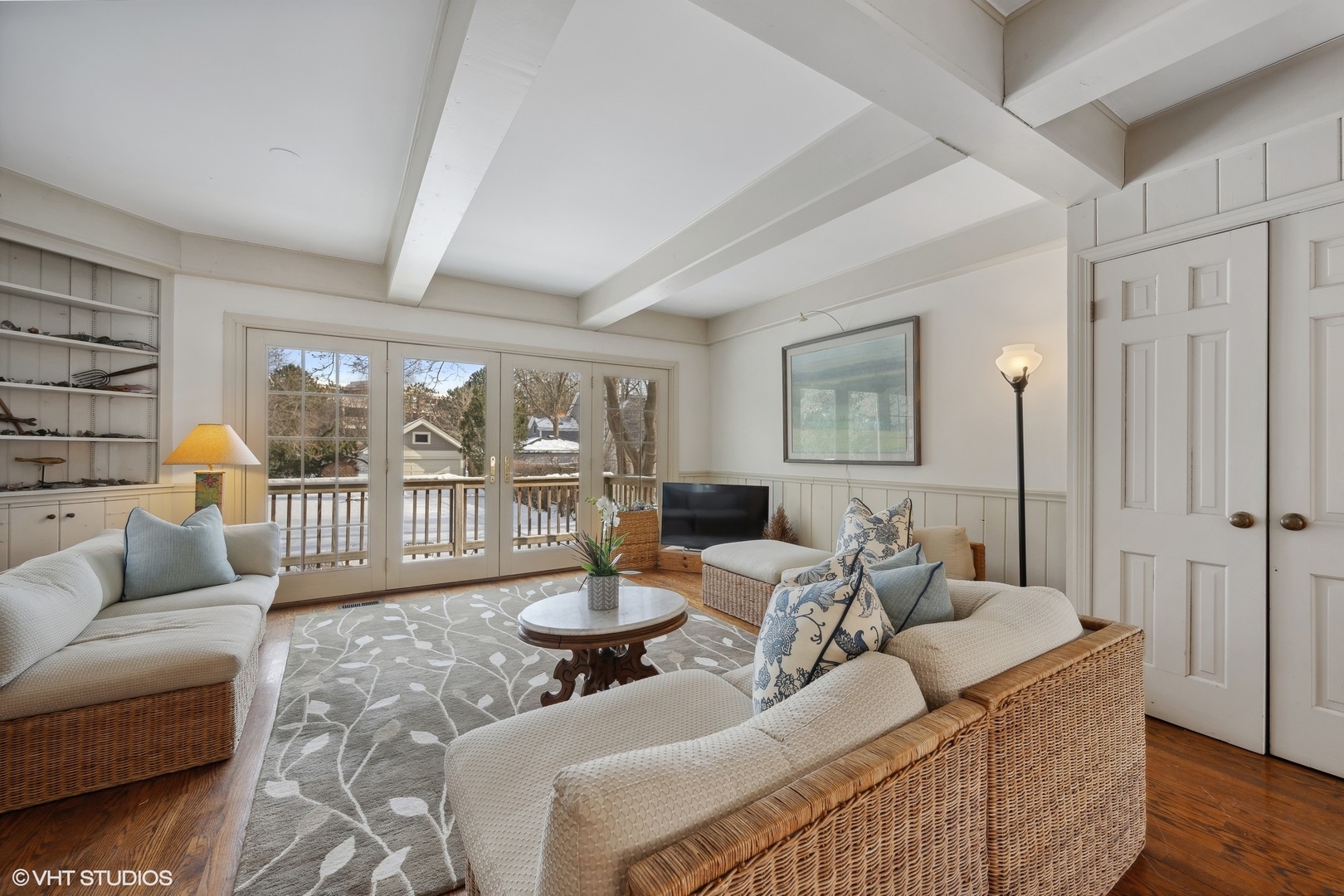 379 Ridge Avenue Winnetka, IL 60093 - Photo 4 of 31 a living room with furniture and a large window with garden view