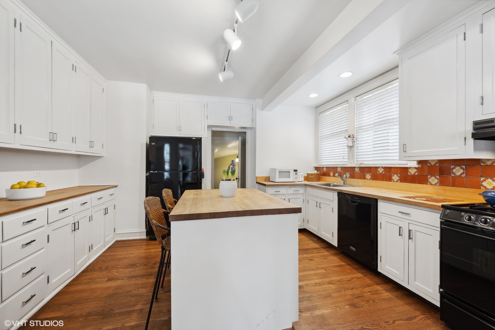 379 Ridge Avenue Winnetka, IL 60093 - Photo 8 of 31 a kitchen with stainless steel appliances granite countertop a sink and cabinets