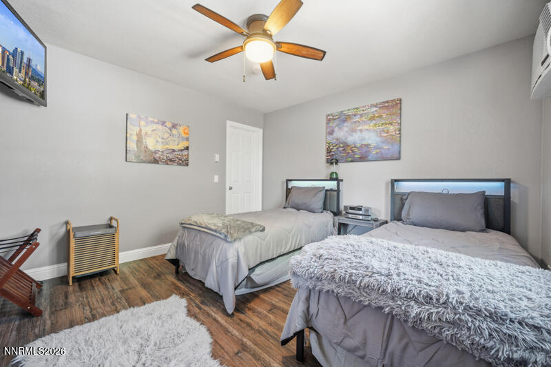 1931 Lousetown Road Reno, NV 89521 - Photo 33 of 51 a bedroom with two beds and a chandelier