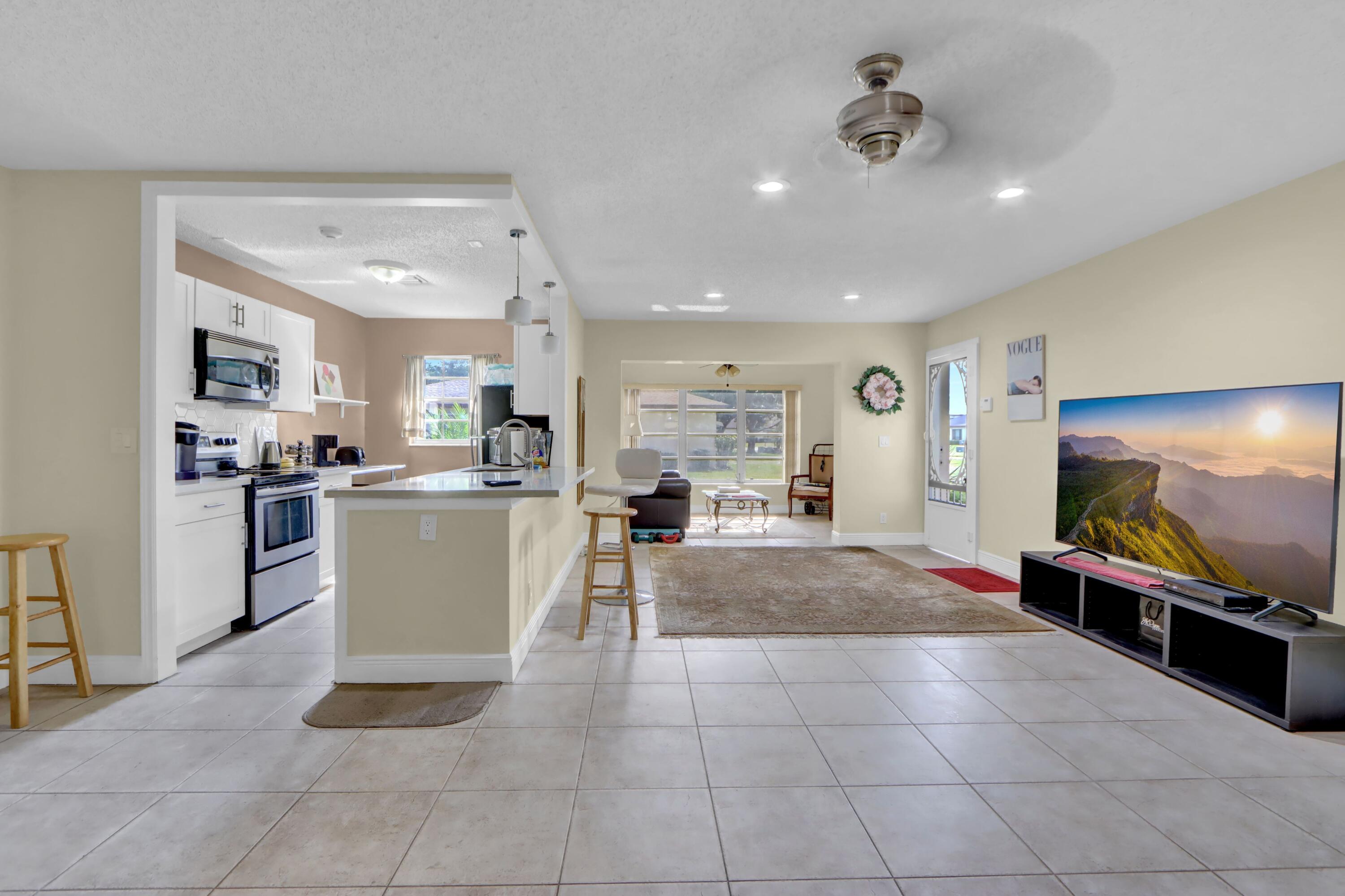 14050 Nesting Way, Unit B Delray Beach, FL 33484 - Photo 6 of 18 Living Area / Dining Area / Kitchen