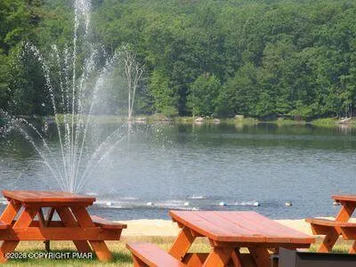 a view of a park with iron fence
