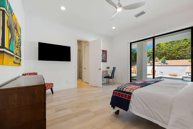 a bathroom with a bathtub sink and mirror