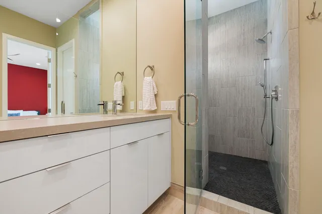 a view of a swimming pool with a patio and a yard