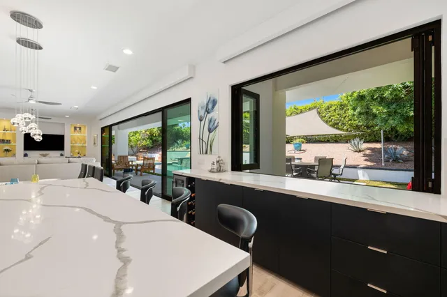 a kitchen with a sink and large window