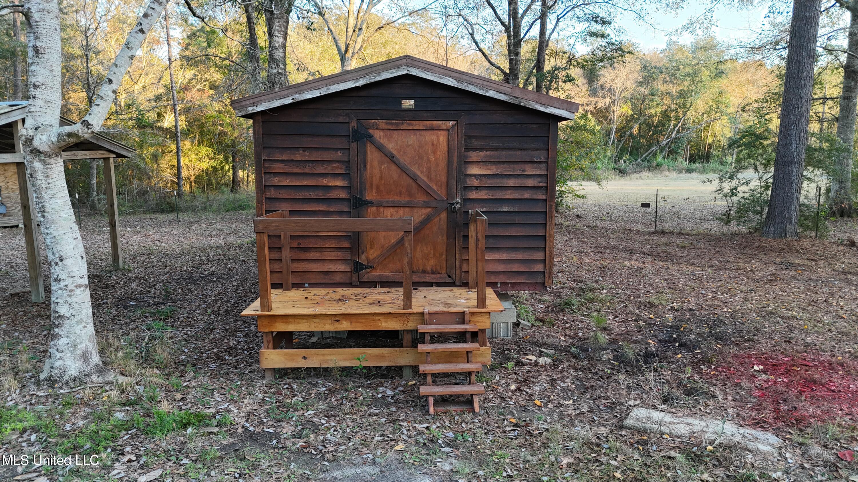 17542 Jones Lane Saucier, MS 39574 - Photo 33 of 39 Storage House