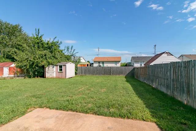 a view of a backyard with a garden