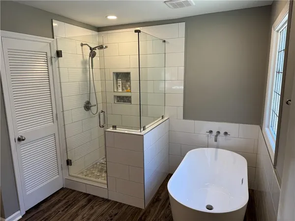 a bathroom with a double vanity sink and a mirror