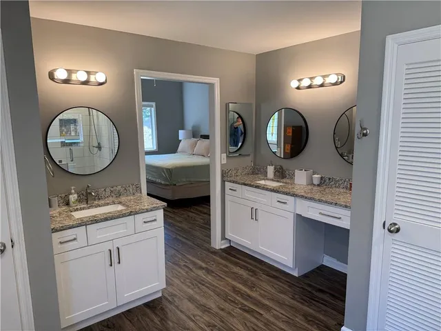 a bathroom with a sink and mirror