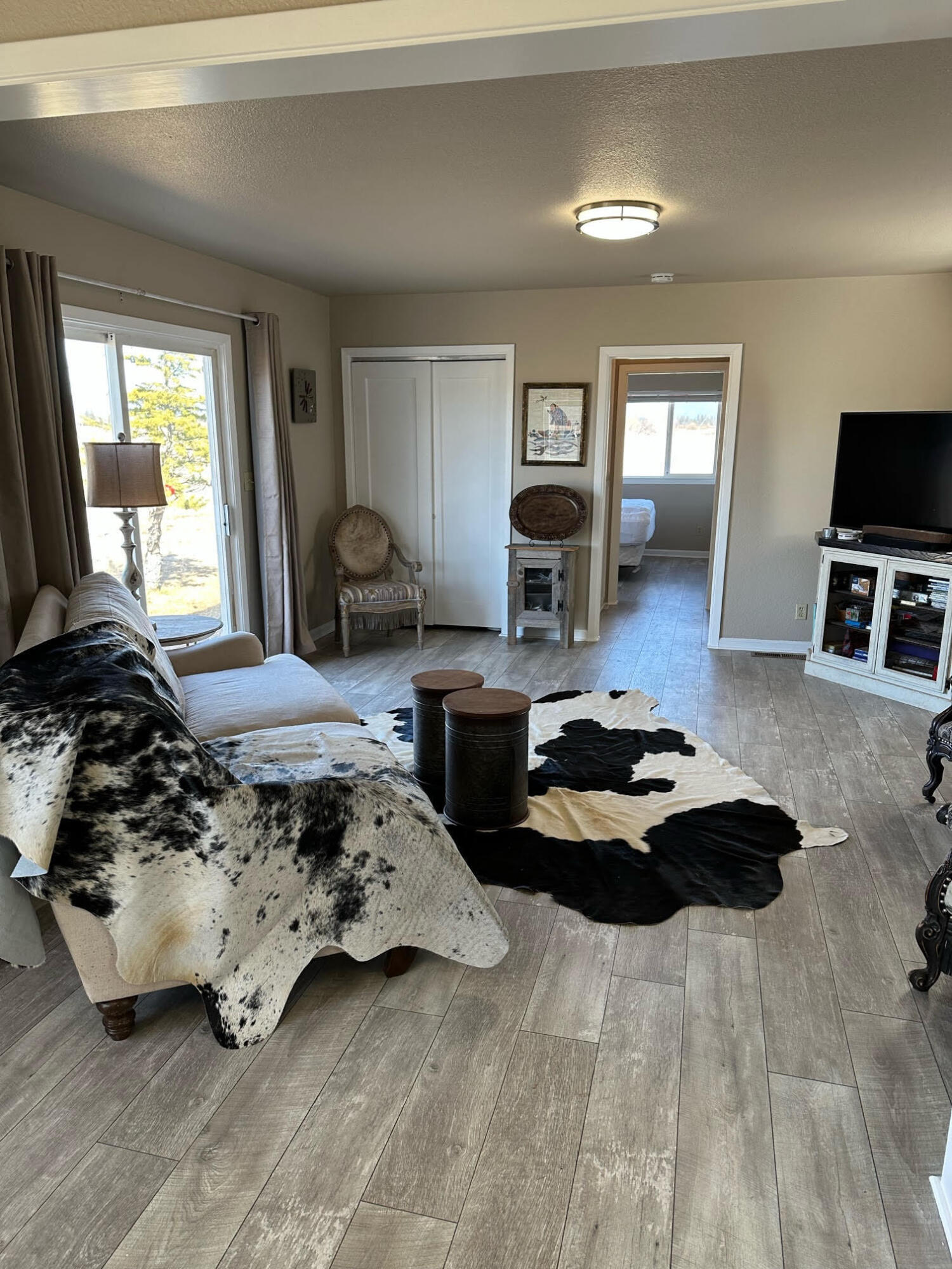 28075 Spring Creek Road Fall River Mills, CA 96028 - Photo 24 of 26 a bedroom with furniture and a flat screen tv