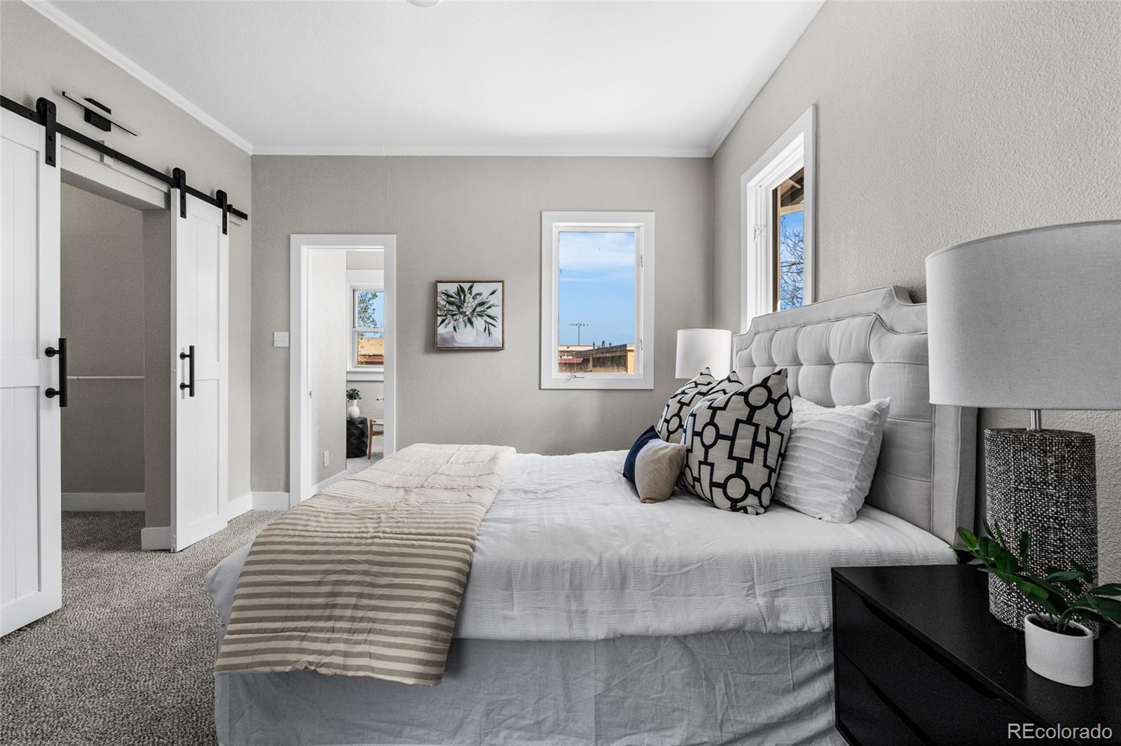 2259 Depew Street Edgewater, CO 80214 - Photo 25 of 46 a bedroom with a bed and a potted plant