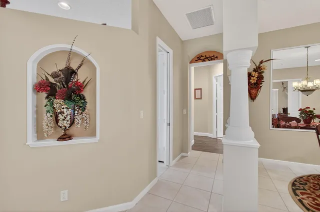 a view of a workspace with furniture and gym equipment